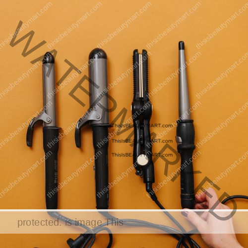 4 different curling irons side by side on a yellow background