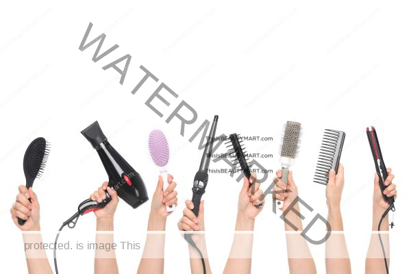 A row of hands holding out various hair styling products, like flat iron, comb, hair brush, hair dryer, and more