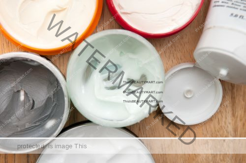 Various of partially-used hair care product jars for men