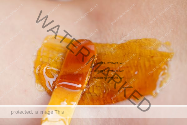 Waxing body hair using a golden honey-like product