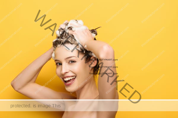 Woman enjoying using shampoo on her hair