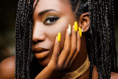 Beautiful black lady with bright yellow nails