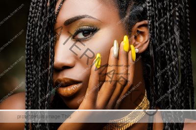 Beautiful black lady with bright yellow nails