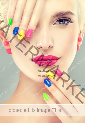 Bright and multi colored summer nails on short-blonde-haired woman